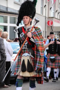 Cultural Connections: A drum major leads his Scottish pipe band down the main street of Portrush, Northern Ireland.