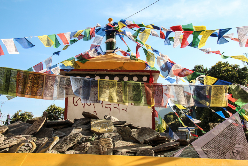 Prayer flags wave from a stupa near the monastery in Tashi Palkhiel, Nepal. (Photo: Victoria Nechodomu/Nechodomu Media)