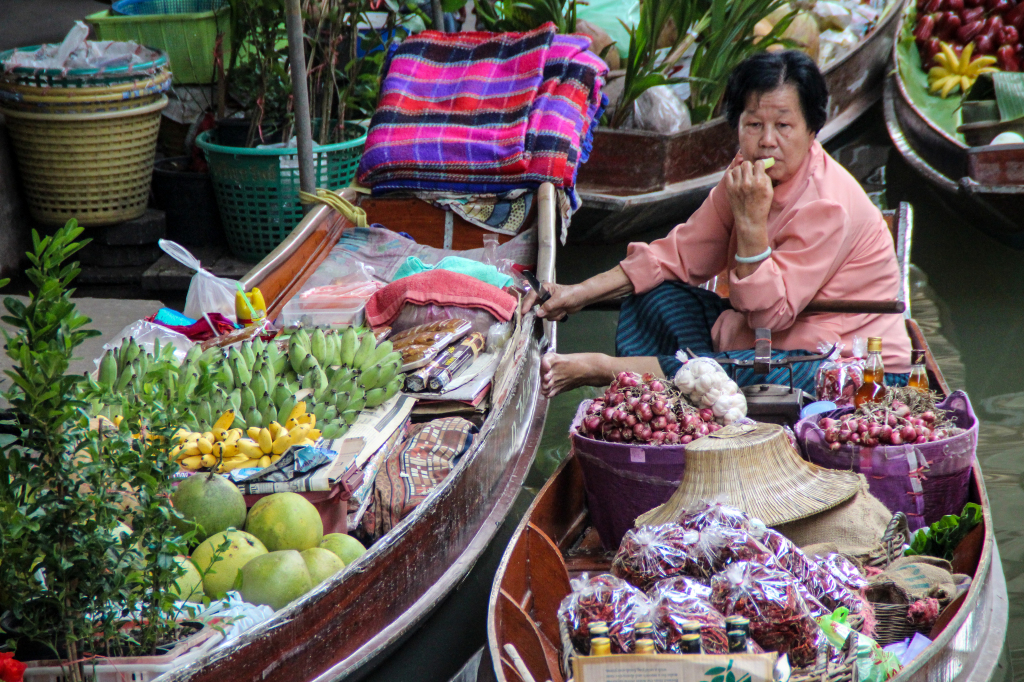 Phui sells essential Thai cooking ingredients from her boat, including chilies and onions. (Photo by Victoria Nechodomu /Nechodomu Media)