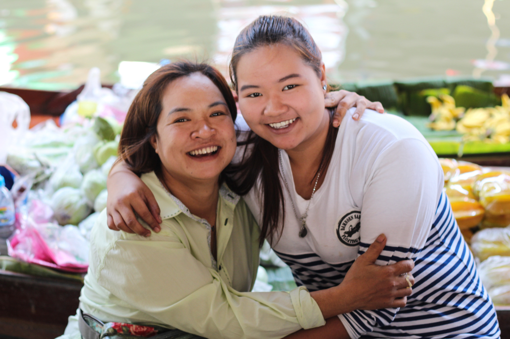 Mother and daughter, Nid and Miw, provide free samples in a quiet canal away from the chaos of the main market. She has been coming here for 14 years.